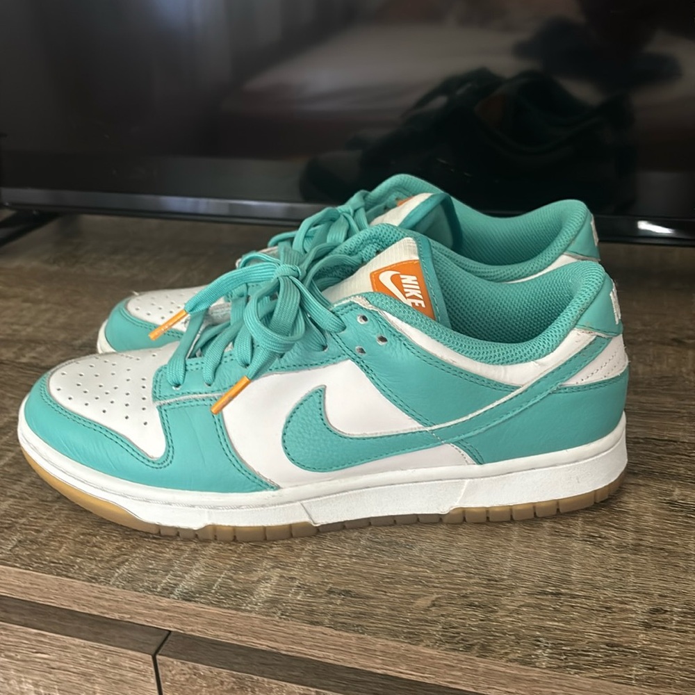 Women’s Nike dunks in the “teal zeal” color. Size 8.5